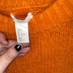 Orange knitted turtleneck